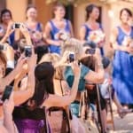 terrible photo of people taking photos at wedding why to have an unplugged wedding